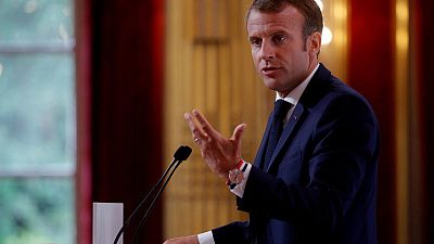 Macron takes election dig at Merkel's party over Hungary
