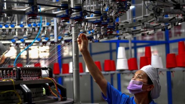 Une ouvrière dans une usine textile à Shangqiu (Chine), le 8 septembre 2018 Une ouvrière dans une usine textile à Shangqiu (Chine), le 8 septembre 2018