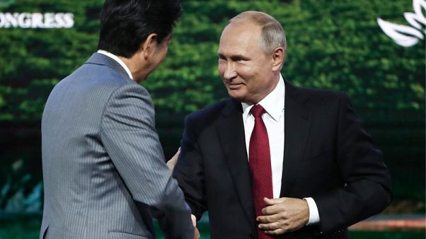 Image result for Russia's Putin tells Japan's Abe: 'Let's sign peace deal this year'
