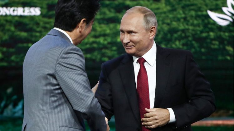 Russia's Putin tells Japan's Abe: 'Let's sign peace deal this year'