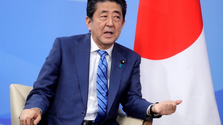 Japan PM Abe says BOJ's easy policy shouldn't continue forever
