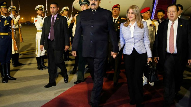China's foreign minister, head of state planner met with Venezuela's Maduro