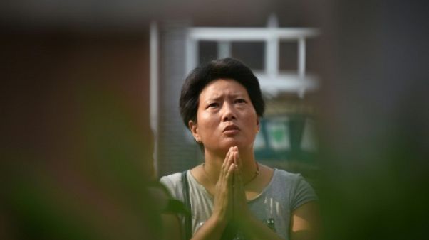 "Nulle part où prier": des catholiques chinois désemparés "Nulle part où prier": des catholiques chinois désemparés