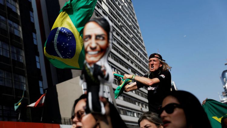 Brazil poll shows Bolsonaro leading with Lula stand-in Haddad second
