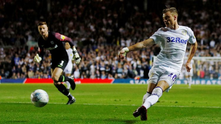 Leeds cruise past Preston to stay top