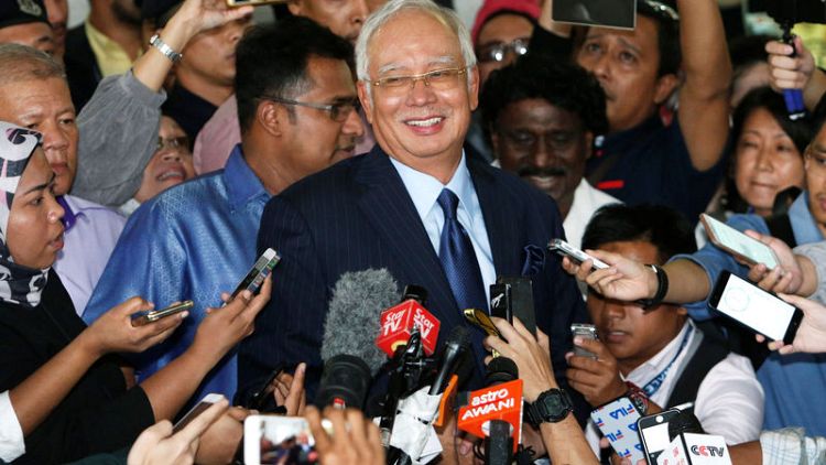 Former Malaysian PM charged with money laundering, abuse of power