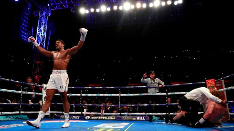 Boxing - Joshua retains heavyweight crowns with Povetkin TKO