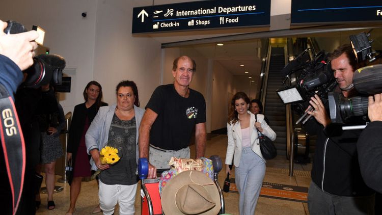 Australian filmmaker freed from Cambodia prison arrives in Sydney