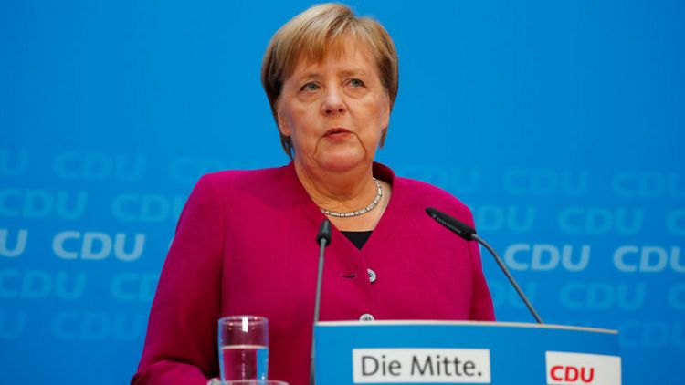 Germany's Merkel says regrets spymaster scandal