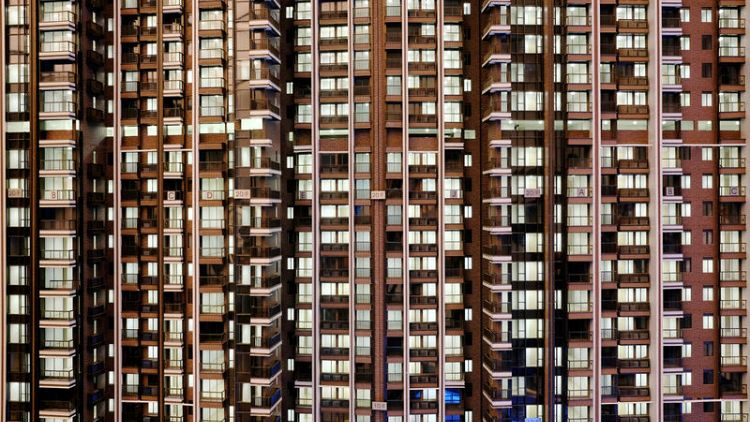 Hong Kong property firms scramble to lure buyers as rate hikes loom