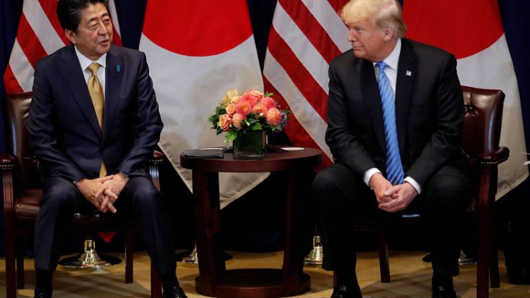 Trump says Japan's Abe agrees to start talks on free trade deal