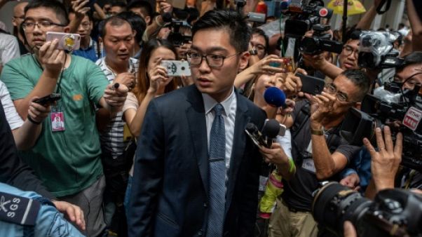 Andy Chan (c), chef de file du Parti national, le 14 août 2018 à Hong Kong Andy Chan (c), chef de file du Parti national, le 14 août 2018 à Hong Kong