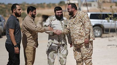 Far from home, a Syrian rebel group starts over Far from home, a Syrian rebel group starts over
