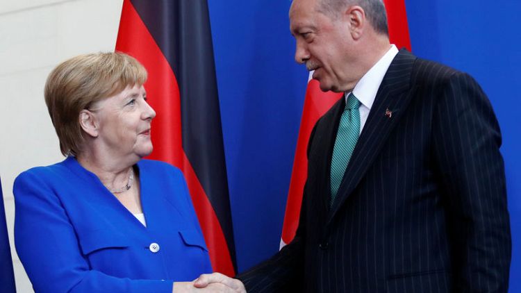 Turkey's Erdogan, in Berlin, pledges EU visa push