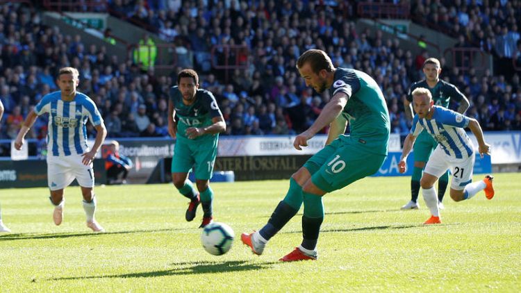 Kane double at Huddersfield sends Spurs fourth