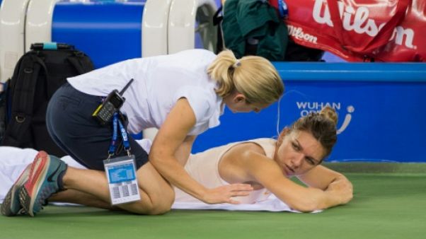 Tennis: la N.1 mondiale Halep abandonne sur blessure à Pékin Tennis: la N.1 mondiale Halep abandonne sur blessure à Pékin