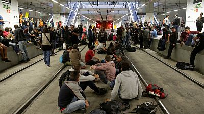 Catalan protesters attempt to block transport to mark referendum anniversary