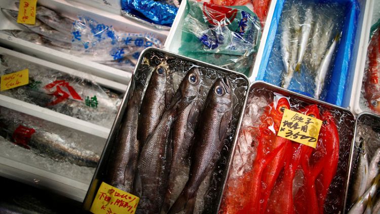 Tokyo fishmongers mourn and protest closure of famous fish market