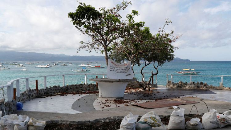 Philippines to rein in visitors to Boracay island, strained by tourism
