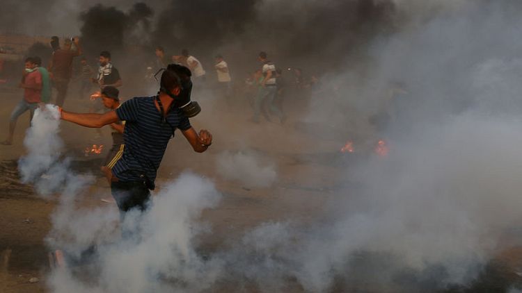 Israeli troops kill Palestinian child and one other protester at Gaza border - medics