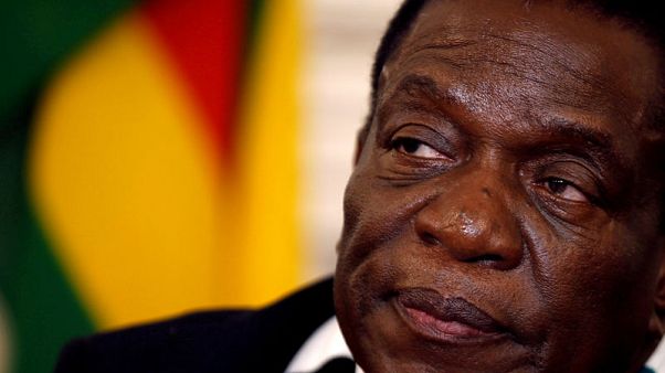 Worried Zimbabweans fill up cars and stockpile goods, bank sees improvement soon Worried Zimbabweans fill up cars and stockpile goods, bank sees improvement soon