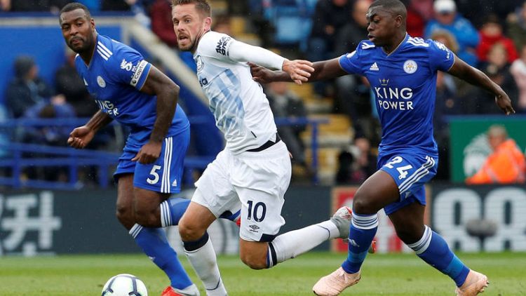 Sigurdsson's dazzling 50th goal sinks 10-man Leicester