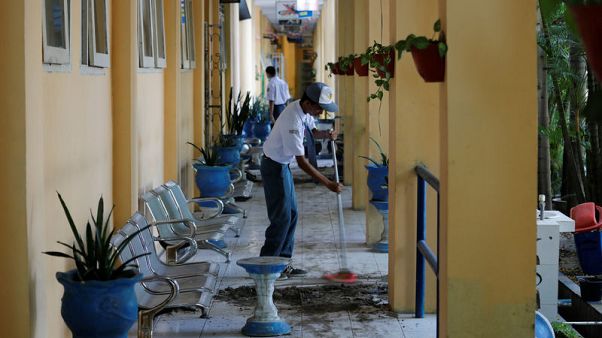 Children return to schools in Indonesia quake city to clean up, find friends Children return to schools in Indonesia quake city to clean up, find friends