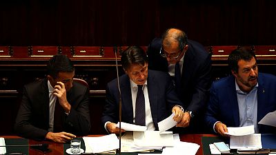 Italy's government digs in over budget plan as pressure rises
