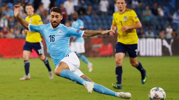 Soccer - Israel beat 10-man Scotland thanks to Tierney own goal
