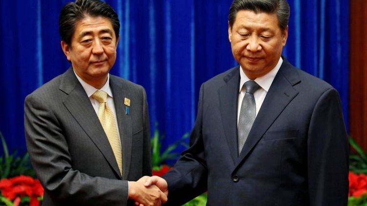Japan's Abe pursues China thaw as U.S-Beijing ties in deep freeze