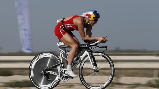 Triathlon - Lange, Ryf set records with repeat wins at Ironman Triathlon Triathlon - Lange, Ryf set records with repeat wins at Ironman Triathlon