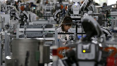 Japan manufacturers' mood rises, trade worries weigh on outlook - Reuters Tankan