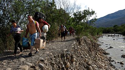 Fleeing hardship at home, Venezuelan migrants struggle abroad, too
