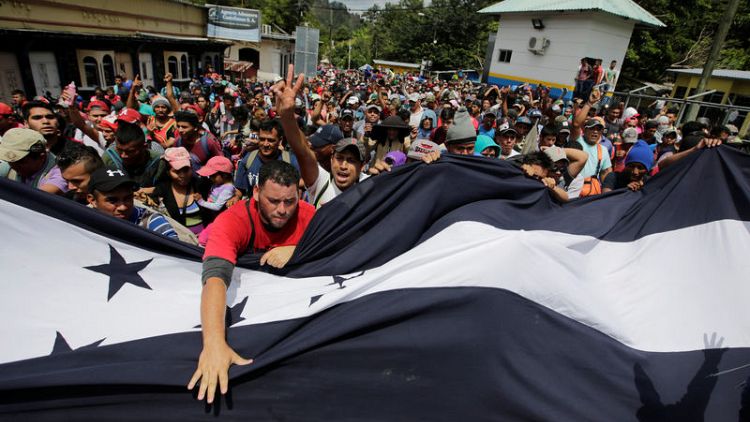 Northbound migrant group doubles in size, enters Guatemala