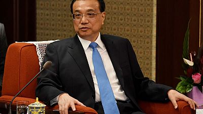 China's premier says economy under increasing pressure amid external volatility