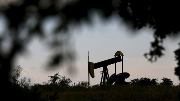 Oil prices edge up, but set for weekly loss on stock build, trade row