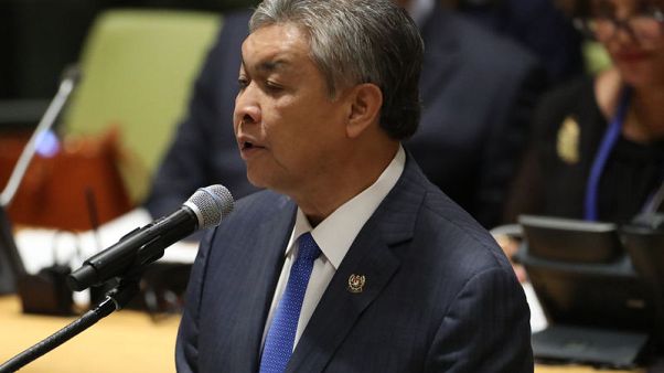 Malaysian ex-deputy PM charged with money laundering, graft Malaysian ex-deputy PM charged with money laundering, graft