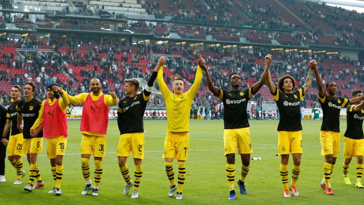 Dortmund crush lowly Stuttgart to stay top