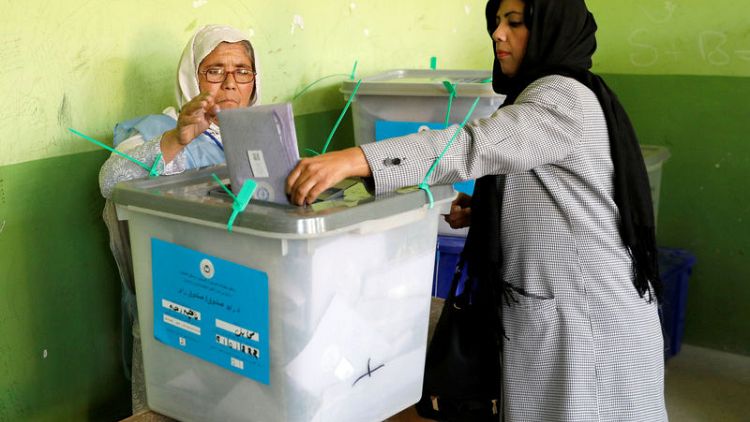 Long queues as Afghan voters defy election day attacks, delays