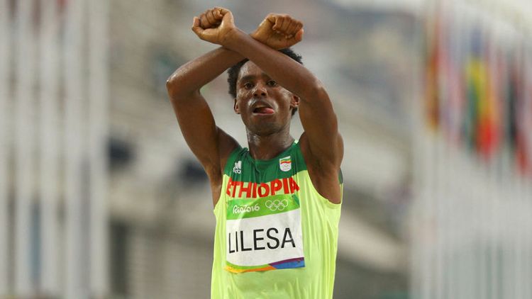 Exiled Ethiopian Olympic runner who protested against government returns home