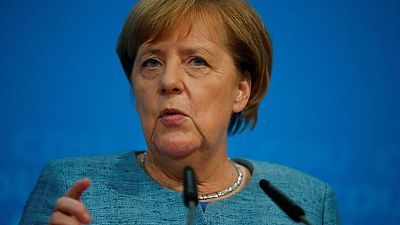 Germany's Merkel promises legislation to ward off diesel driving bans