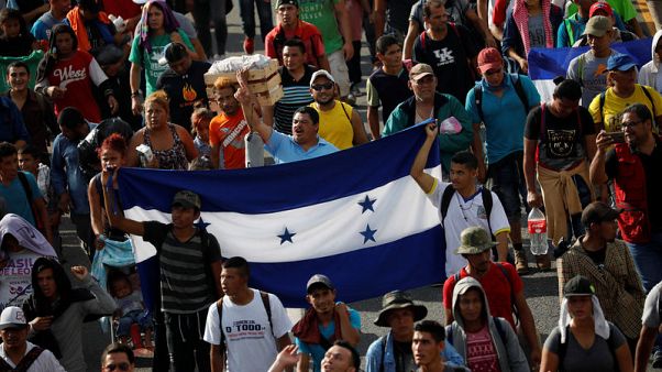 Thousands in U.S.-bound migrant caravan pour into Mexican city Thousands in U.S.-bound migrant caravan pour into Mexican city