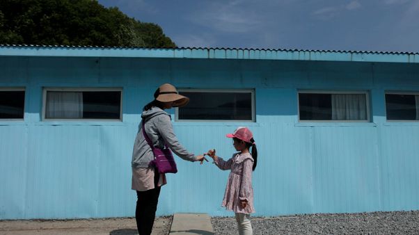 Two Koreas, U.N. forces agree to remove weapons at border Two Koreas, U.N. forces agree to remove weapons at border