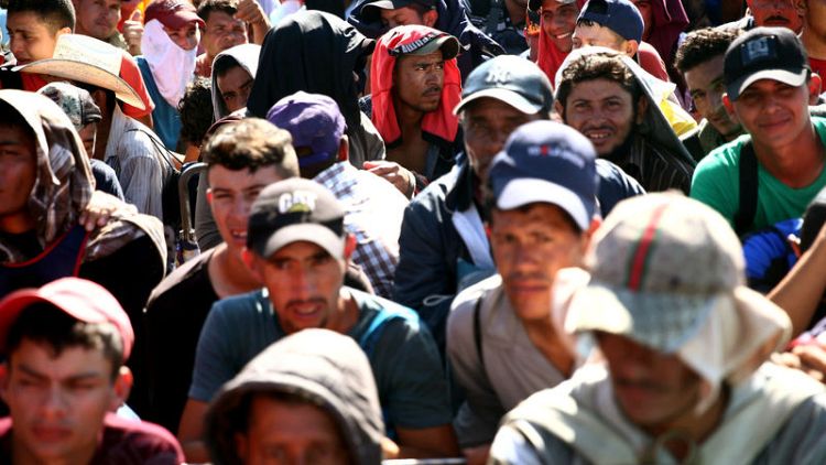 Trump vows to cut Central America aid, raises alarm on migrant caravan