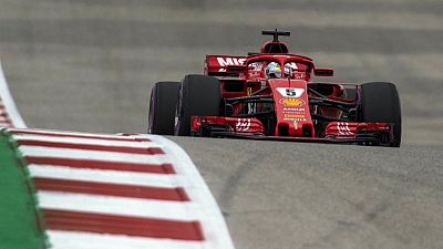 Vettel clings on mathematically for another week