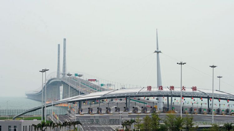 China's Xi opens major sea bridge during symbolic tour to southern China
