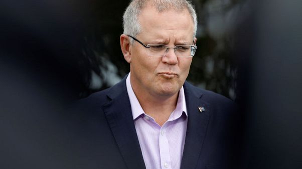 Refugee offer could strengthen embattled Australian PM's grip on power Refugee offer could strengthen embattled Australian PM's grip on power