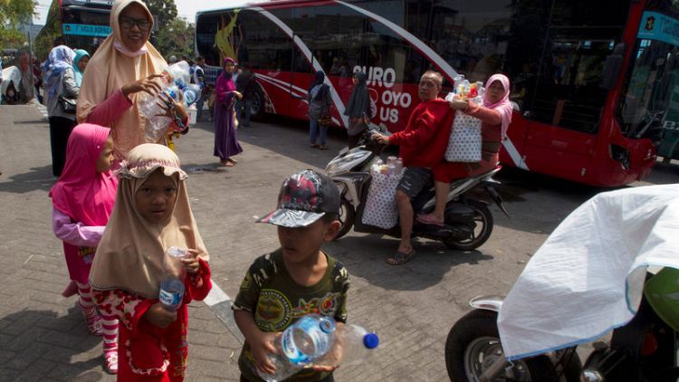 Plastic to ride - Indonesians swap bottles for bus tickets