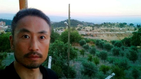 Japan PM Abe 'relieved' at hostage's release but wants to confirm identity Japan PM Abe 'relieved' at hostage's release but wants to confirm identity