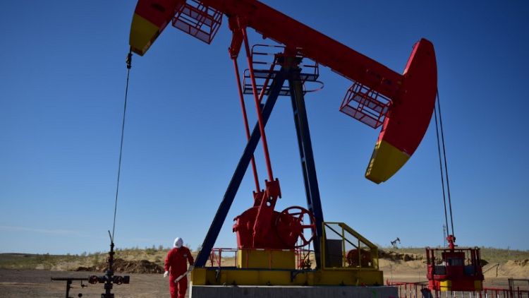 Oil edges back from big slump as Iran sanctions return to focus